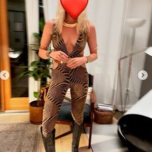 Brown and copper zebra-print jumpsuit with a deep V-neckline and side cut-outs.